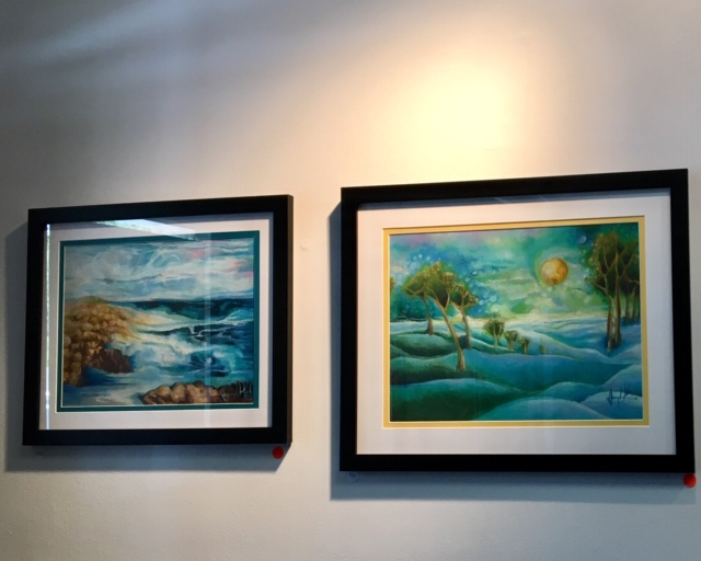Two amazing artworks hung on a wall